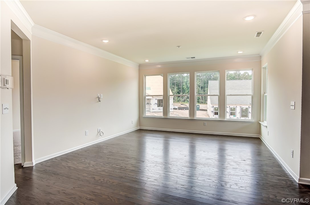 Photo represents the plan, not the actual home. Design selections may vary. Bright and spacious family room.