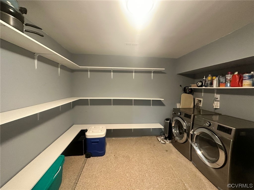 Washroom with washer and clothes dryer, carpet, and hookup for a washing machine