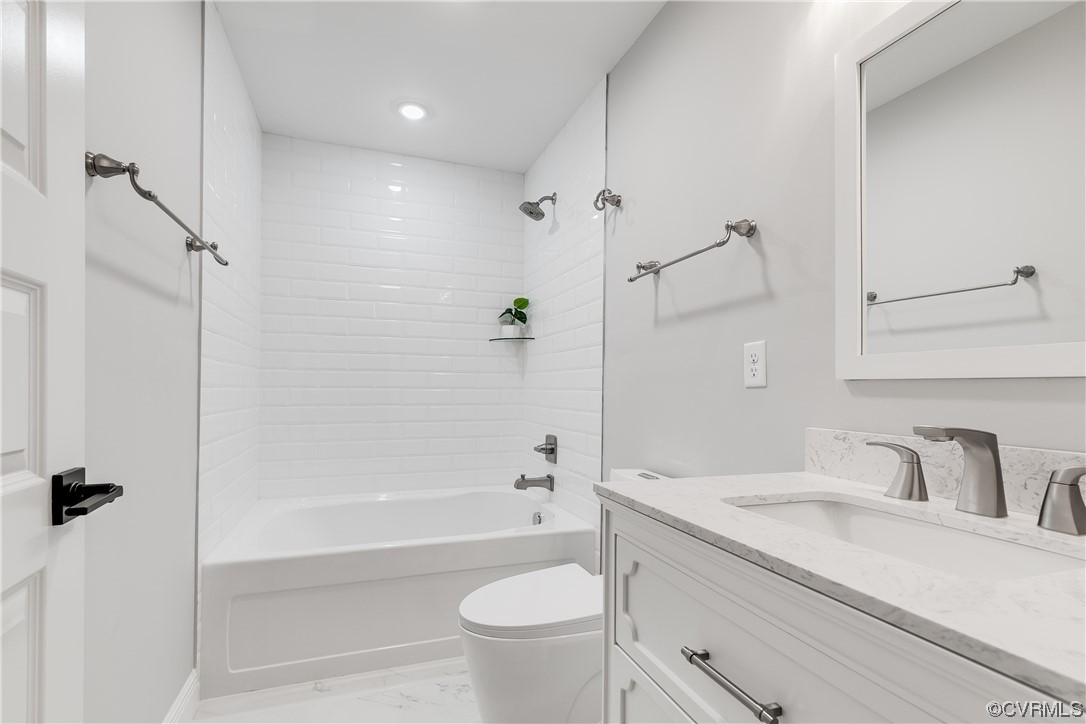 Bedroom #2 full bath with LARGE tub, crisp white subway shower surround