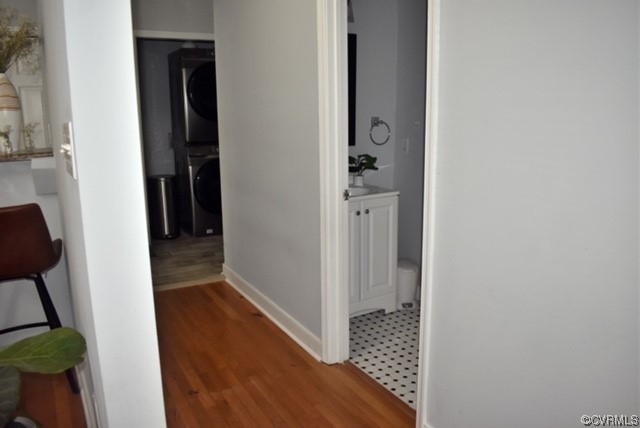 Corridor featuring Wood Floors & Half Bath