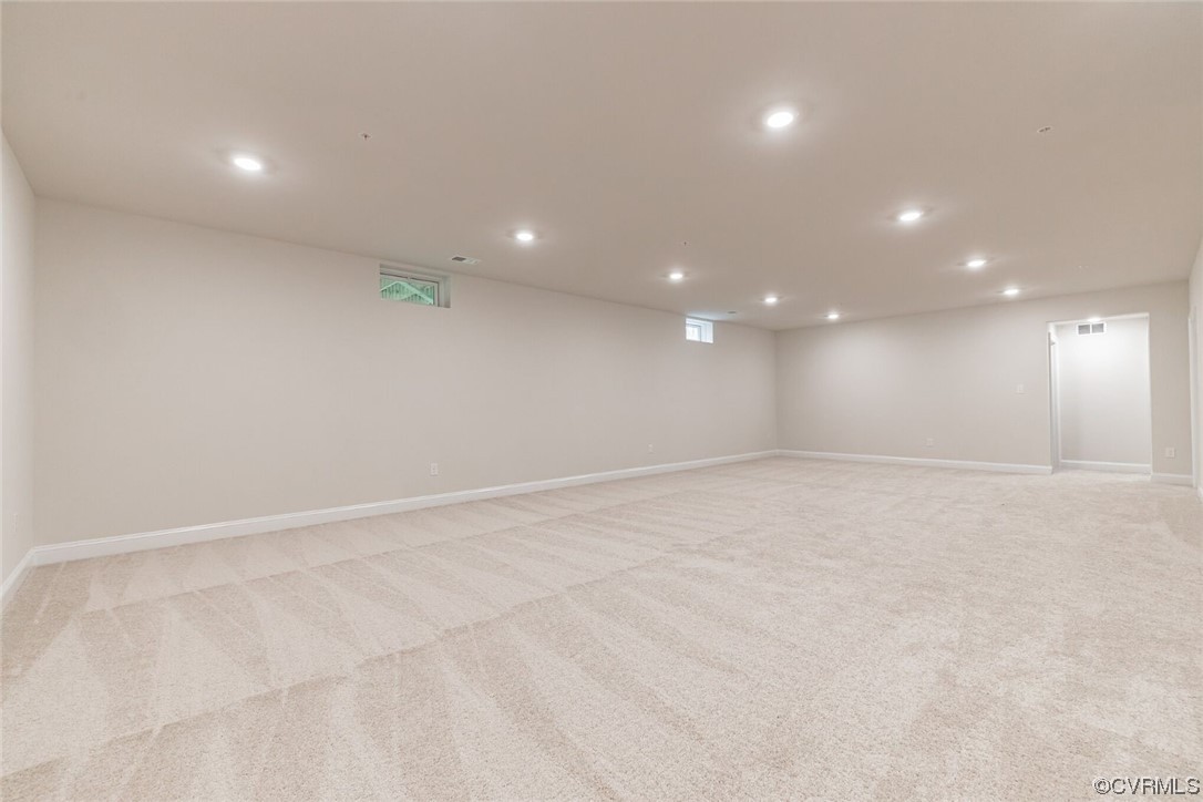 Basement with light carpet