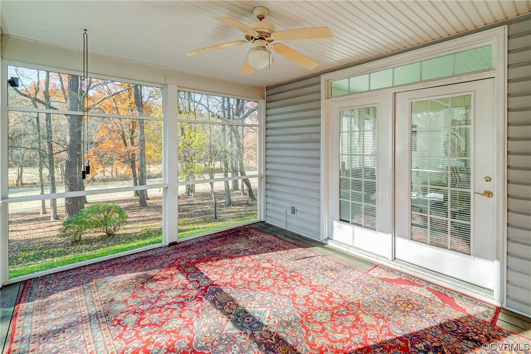 Screened porch with view of golf course with French door entry into Florida room