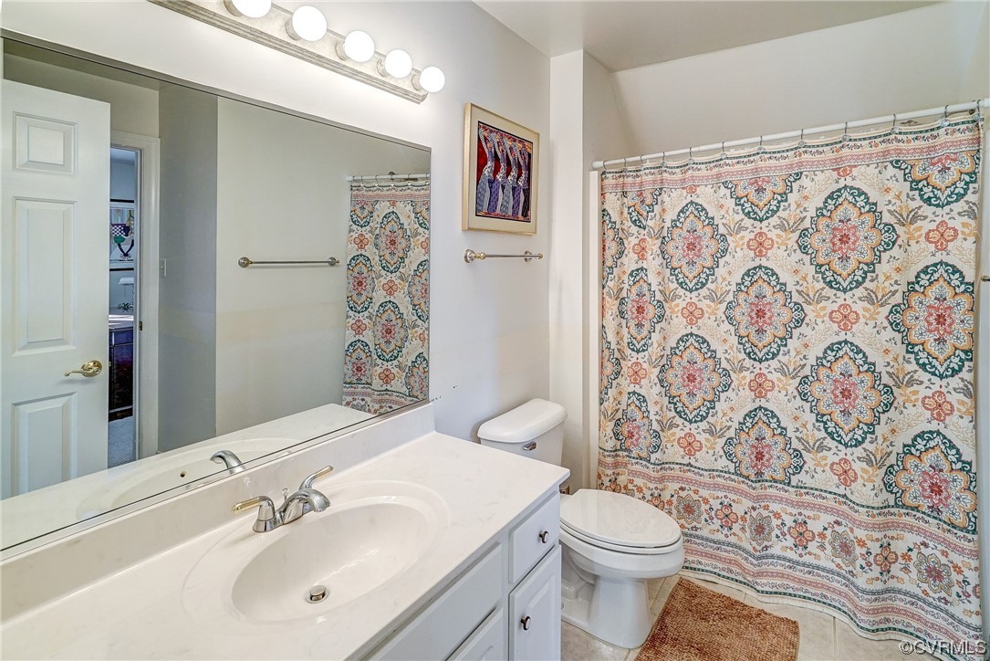 2nd floor full bathroom featuring  tile flooring, tiled tub/shower, and vanity