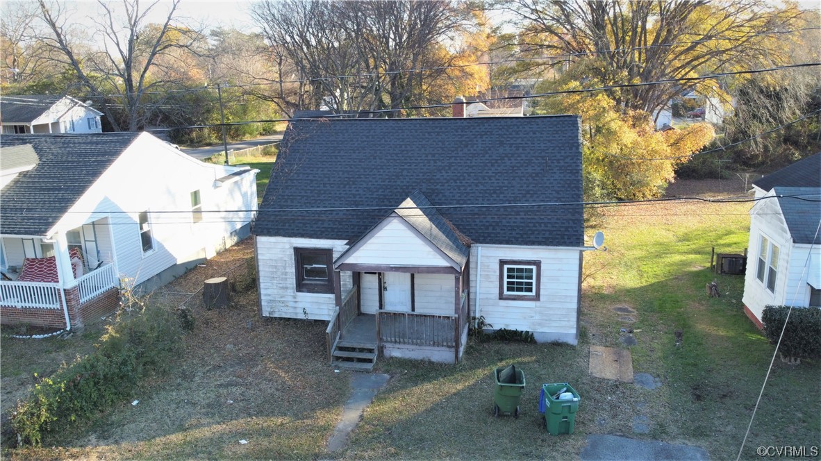 View of front of property with a front lawn