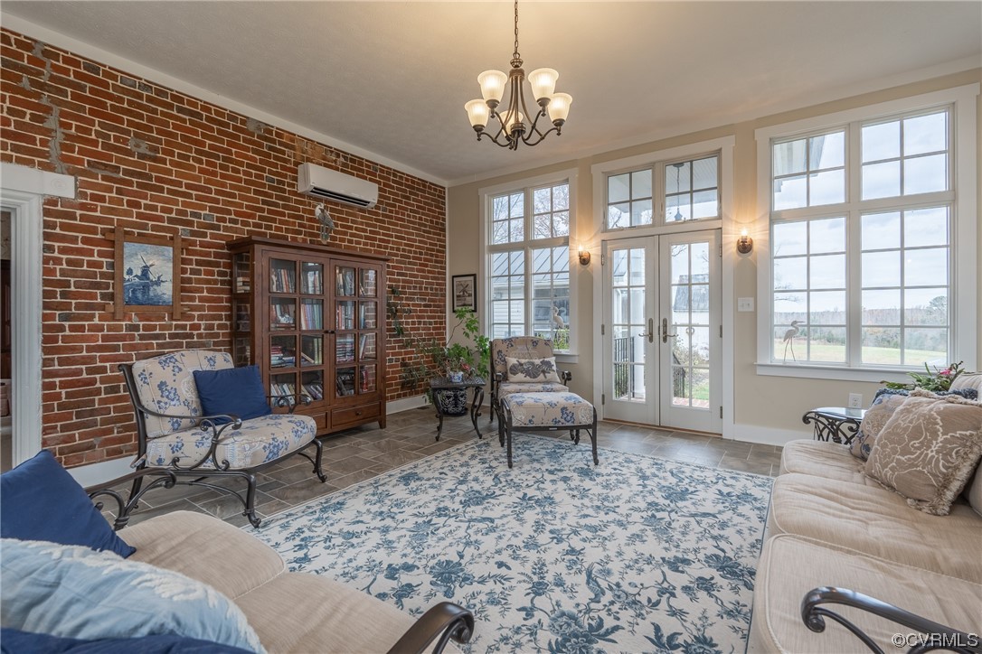 Tiled Sun Room with exposed brick wall, multiple windows with transoms, French door to exterior
