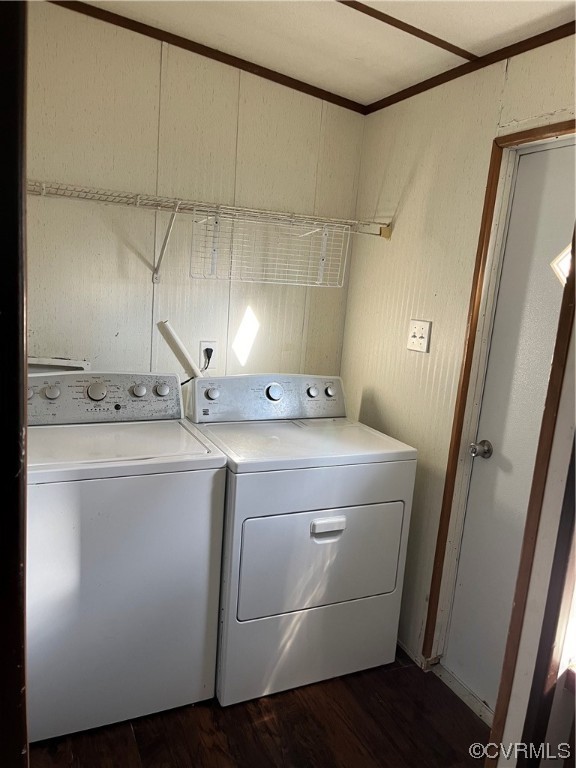 Laundry area featuring independent washer and dryer and dark hardwood / wood-style flooring