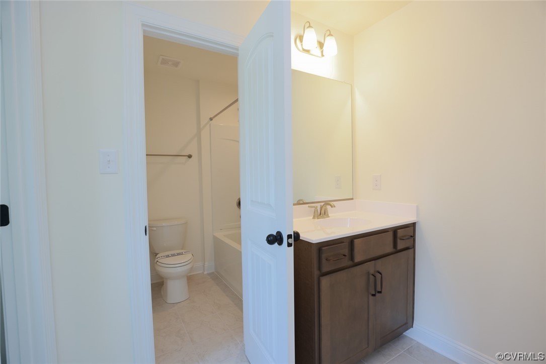 Bedrooms 2 & 3 w/ walk-in closets share a Jack & Jill bath w/ dual vanities.