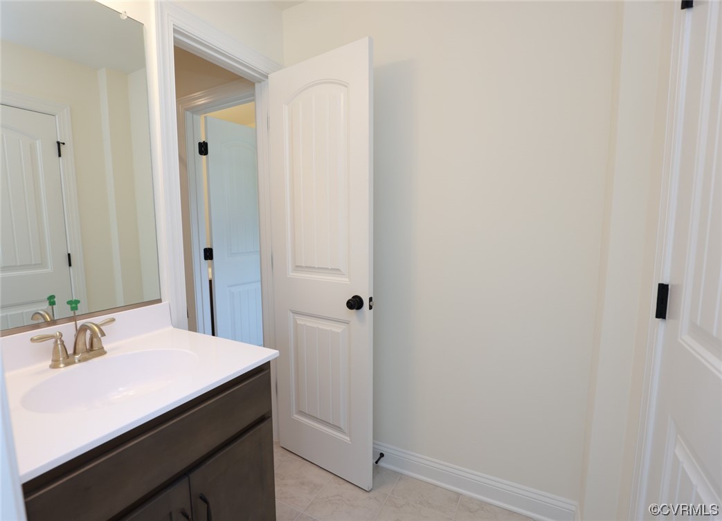 Bedrooms 2 & 3 w/ walk-in closets share a Jack & Jill bath w/ dual vanities.