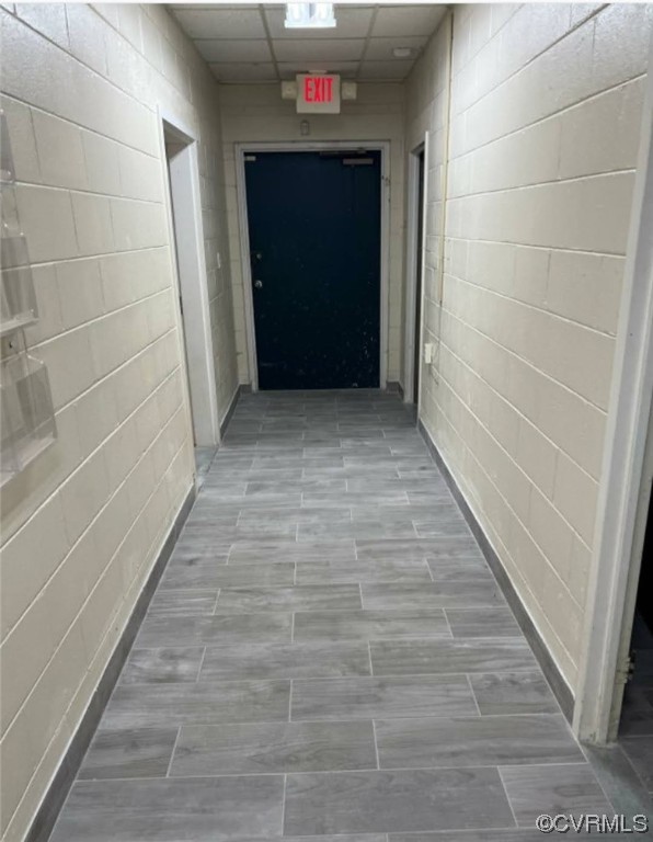 Corridor featuring a drop ceiling