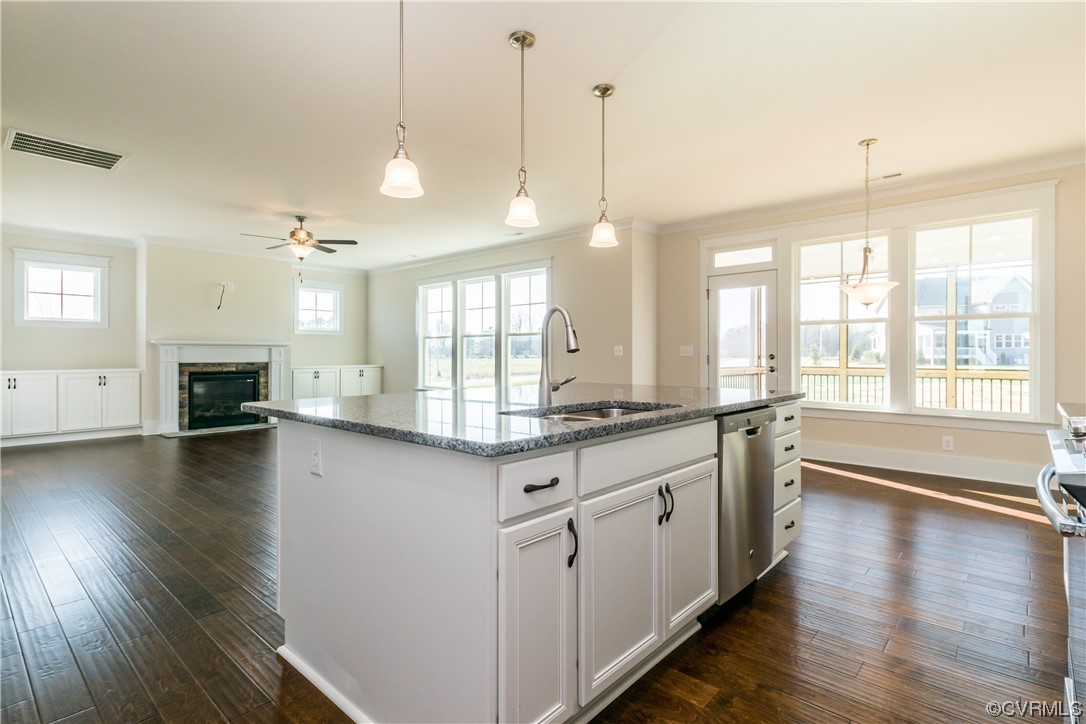 Photo represents the plan, not the actual home. Design selections may vary. DESIGNER kitchen, ideal for entertaining, features an island, quartz counters, Butler's pantry, gas cooking, wall oven, SS appls, kitchen backsplash and LED recessed lighting.
