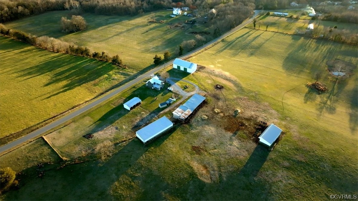 Birds eye view of property featuring a rural view