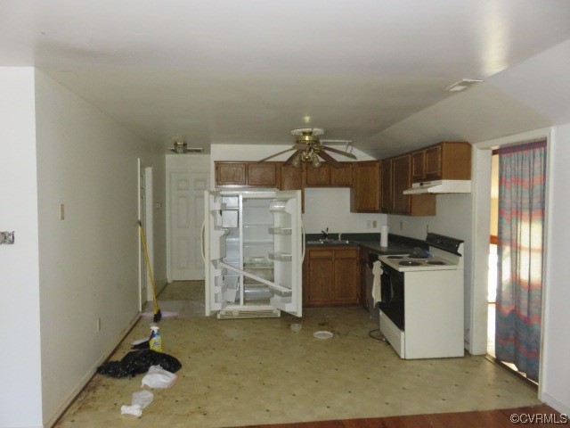 Kitchen featuring white range with electric stovetop and ceiling fan