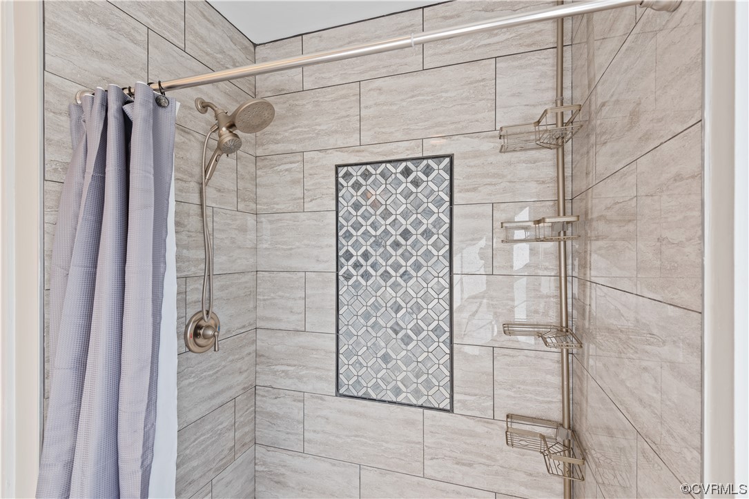 Bathroom with curtained shower