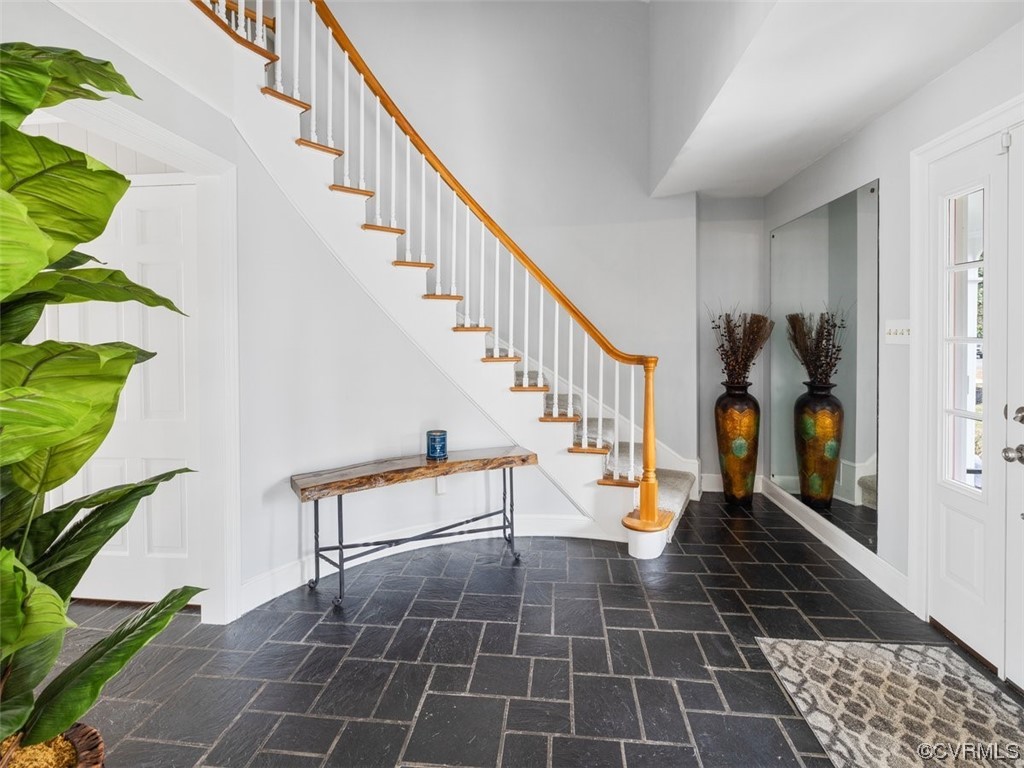 2 story foyer with spiral staircase