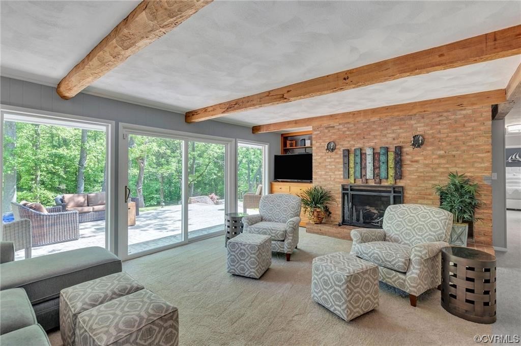 family room with wood beams and stunning views. This is before the water feature was added on the patio