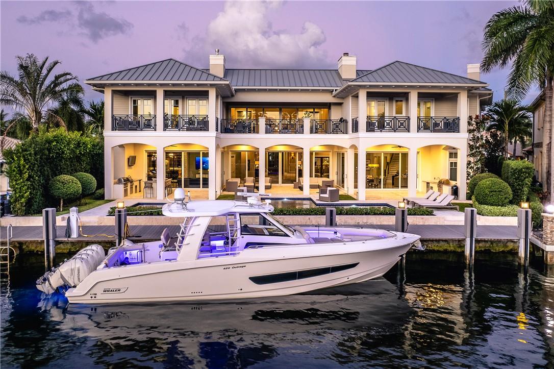 Striking Waterfront Estate in Lighthouse Point. This 7 bedroom, 7.5 bathroom mansion has a heated saltwater pool, 87 ft of waterfront, ocean access with no fixed bridges, and that's just the start. It's an entertainer's dream of a home, comprised of a 1,350 bottle wine cellar, multiple terraces, a gym, a full bar with a keg on tap, an outdoor kitchen with 1 gas & 2 charcoal Grills, fireplaces, and a piano room. Watch the sunset from your own personal balcony or Stack the glass walls bringing together the inside and outside living areas to create the perfect open feel. Excellent location only minutes from the ocean, whether you decide to drive or take your boat. Close to dining, shopping, entertainment, major roadways, and much more.