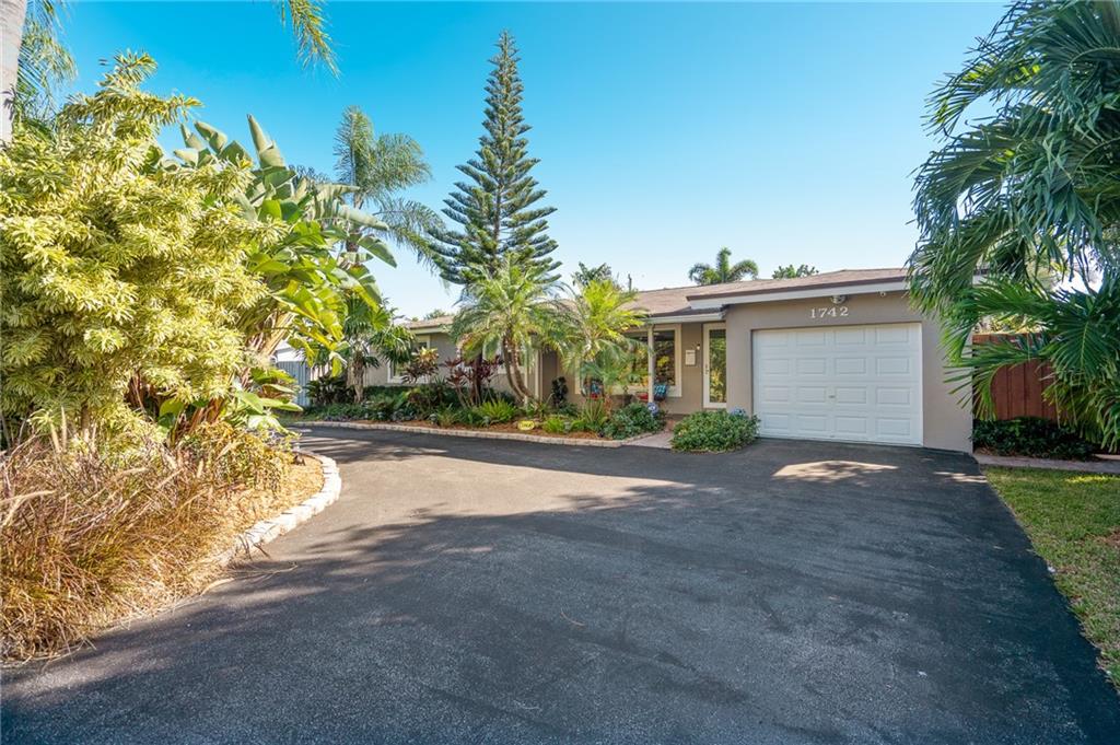 Don't hesitate on this single family gem located in the desirable Coral Estate neighborhood in East Wilton Manors! This home features three bedrooms, two & one half bathroom and a beautiful open, kitchen, living, and dining room concept. The backyard oasis is breathtaking, and comes complete with a spacious pool, jacuzzi tub, outdoor shower and ample green space. The spacious pool, is heated and has both salt water, and chlorine capability. Bonus features include a large single car garage, laundry/utility room, terrazzo flooring throughout & hurricane impact windows and doors.