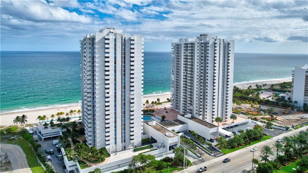 Welcome Home to this luxurious oceanfront high-rise that sits on fabulous sandy beach. The Renaissance I offers stunning Sky lounge, billiards, table tennis, library, gym, and lovely pool area with barbecues. this unit has its own washer and dryer Second bedroom features built-in murphy bed and desk This building has finished it 40 year certification and has all impact windows. cone be on vacation every day!
