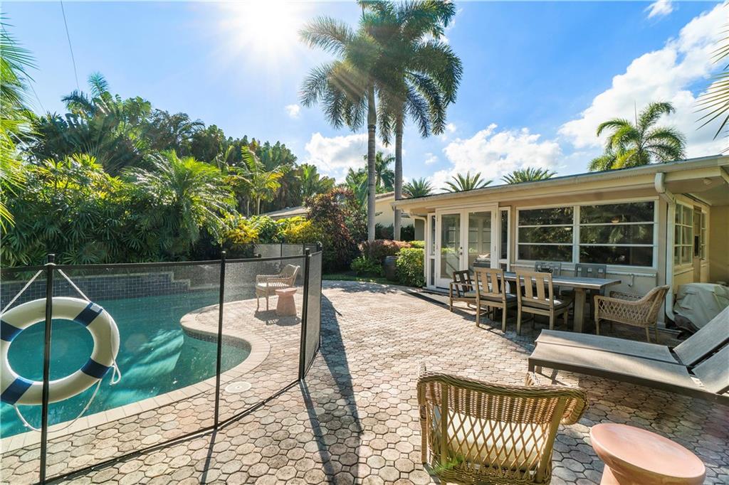 Amazing opportunity to own an updated gem in sought after Victoria Park . Gracefully nestled on tropical lot with plenty of privacy on one of the best tree lined streets. The perfect open floor plan offering multiple rooms for entertaining with great room and family room. Walls of windows overlooking the outdoor retreat with private saltwater pool and huge patio for entertaining. Primary bedroom and guest bedroom plus pantry have custom closet systems. So many great features: Impact windows, Newer 3.5 AC, duct work, fans, tankless WH, Plantation shutters, insulation, new pool heater and newer pool equipment. Option for turn key living with close proximity to Las Olas Blvd. Downtown and Beach. Vacation rental potential.