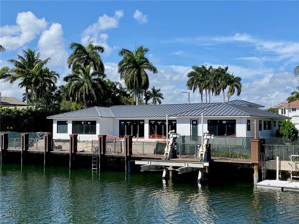 Wait until you see this amazing opportunity in the prestigious Harbor Beach being completely overhauled and redesigned to truly embody the South Florida lifestyle with 125' on the water! This home is the ultimate boaters' paradise only a 10 minute ride out to Port Everglades and less than 5 mins to the intracoastal! The property is being transformed with a complete interior renovation, new roof already installed in 2021, new impact windows & doors, new electrical & plumbing, new generator, wet bar & much more too list! A brand new saltwater pool is being built out back complete with a large overflow spa and floating deck! The property is being offered while in construction at a discount for a new buyer to close, pick their finishes and wait for paradise!!!!