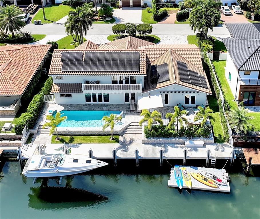 Over 3,700 sqftf waterfront oasis with deep water canal access to Intracoastalcoastal in ocean-inlet community.  First & second-floor primary BR suites, 3.5 baths; multiple French door access to outdoor living and kitchen; abundant storage PLUS walk-in attic, maple/granite kitchen; marble floors throughout.  Second-floor panoramic views w/French door balcony access from primary BR suite, generous walk-in marble shower, and a spa tub. Oversized 2 car garage with built-in storage. NEW coastal home exterior; marble tile front & back; concrete dock and seawall; 20,000 lb. boat lift; high impact doors/windows with automatic shades and awnings; solar panels; and waterfall pool with sun shelf. $500K in improvements since 2018 (see list attached). Easy to show!