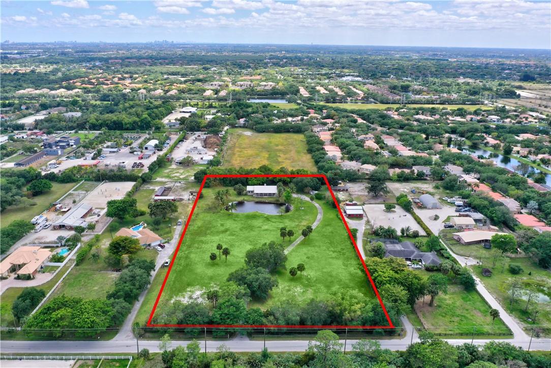 Remodel or Knock down & make it your own! Centrally located in the heart of Coconut Creek with excellent schools!! No HOA & No restrictions. This 4/4 home sits on ALMOST 5 ACRES of land with a pond & tons of green space providing incomparable privacy & seclusion! Roll-A-Den shutters, tile floors, open floor plan, vaulted ceilings w/recessed lights, family room, laundry room w/storage & tub, each guest room has a private bathroom en suite, Master boasts His/Her closets and the covered front porch is perfect for enjoying the beautiful Florida sunsets. 2 wells & a water filtration system. Sheds for extra storage/Room for a pool. Bring all your toys: RV, boats, 4 wheelers, etc.! This property is what South Florida living was meant for! These lots are rare. Close to Sawgrass, shopping & dining. Uses for 4300 Vinkemulder Road, Coconut Creek, FL 33073

Sec. 13-322. A-1 agricultural district.
(a) Purpose. It is the purpose of the A-1 agricultural district to:
(1) Permit agricultural production and related rural activities; and
(2) Protect undeveloped areas from premature or substandard urban development.
At such time as appropriate, lands within this zoning district shall be rezoned in accordance with the land use provisions of the comprehensive plan. Lot size provisions of this district permit single family
(b) Permitted uses. Permitted uses in the A-1 agricultural district are as follows: 
(1) Agriculture uses and buildings subject to the regulation in section 13-339;
(2) Single family detached dwellings subject to the regulations of subsection (d) of this section;
(3) Hunt clubs and riding stables subject to the regulations in section 13-339;
(4) Plant and tree nurseries, excluding sales operations, subject to the regulations in section 13-339;
(5) Public and private schools and public utilities subject to the regulations in section 13-339;
(6) Public outdoor leisure facilities and recreation, park and conservation areas, subject to the regulations in section 13-339;
(7) Utility facilities subject to the regulations in section 13-339;
(8) Accessory uses and structures subject to the provisions of Division 4 of this article
(9) Community residential home;
(10) Assisted living facility subject to the definition of family
(11) Family day care home;
(12) Family foster home subject to definition of family;
(13) Residential licensed service provider subject to definition of family.
(c) Special land uses.
(1) Golf courses subject to the regulations in section 13-339;
(d) Development regulations. Development regulations for single-family detached residential uses in the A-1 agricultural district are as follows: 
(1) Minimum lot area: Two (2) acres;
(2) Minimum lot width: Two hundred (200) feet;
(3) Minimum lot depth: Three hundred (300) feet;
(4) Minimum front setback: Fifty (50) feet;
(5) Minimum side setback: Fifty (50) feet;
(6) Minimum rear setback: Seventy-five (75) feet;
(7) Maximum building height: Thirty five (35) feet;
(8) Maximum paved area: Five (5) percent of total lot area;
(9) Minimum open area: Eighty-five (85) percent of total lot area;
(10) Minimum open space: Seventy-five (75) percent of total lot area;
(11) Minimum air conditioned dwelling unit size: Two thousand (2,000) square feet for one (1) bedroom, two thousand two hundred (2,200) square feet for two (2) bedrooms, two thousand four hundred (2,400) square feet for four (4) bedrooms, plus two hundred (200) square feet for each additional bedroom/den.
(12) Roof design. A minimum of 3:12 pitch unless established architectural features can substantiate otherwise. A non-asphaltic based roof material is required on all primary structures.
(Ord. No. 115-86, 306.02, 7-10-86; Ord. No. 159-87, 306.02, 6-11-87; Ord. No. 166-89, 6, 10-26-89; Ord. No. 103-96, 1, 1-25-96. Ord. No. 2000-36, 3, 9-14-00; Ord. No. 2016-33, 2, 8-11-16)