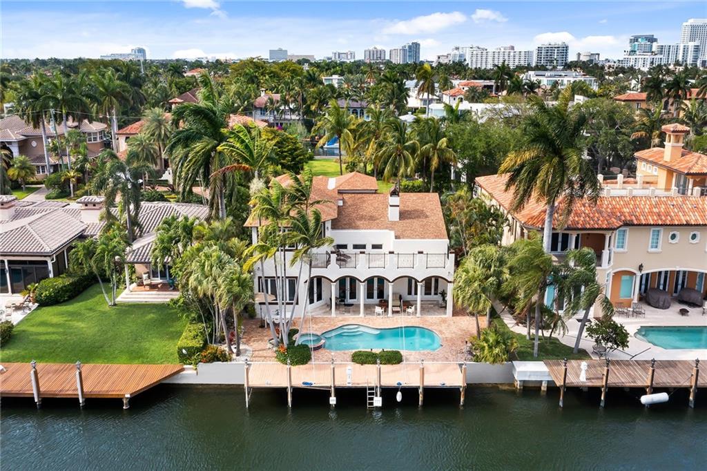 Located within the prestigious Seven Isles neighborhood and just mere minutes to the Atlantic Ocean sits this masterfully built, custom 2-story residence with 75' of straight-line dock/dockage.  This fabulous waterfront lifestyle home offers 4 ensuite bedrooms, 4.5 baths, ground floor VIP suite, impact windows/doors, a new roof (2020), newer AC’s, “Great Room”  floor plan, chef’s kitchen with the most amazing kitchen island, gas cooktop, stainless appliances, two-car garage, storage rooms, full house generator, heated pool, and spa! Enjoy the amazing southern views from the second-floor open balcony and the peekaboo views of the Intracoastal yachting parade from the privacy of your backyard! South Florida living at its best!!