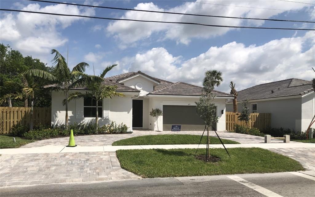STUNNING ALMOST NEW 3 BEDROOM-2BATH HOME IN THE HEART OF WILTON MANORS AND MINUTES TO THE NIGHT LIFE!! THE HOME OFFERS WOOD STYLE TILE FLOORS THRU-OUT THE ENTIRE HOME, MODERN STYLE KITCHEN WITH GRANITE COUNTERS AND A TILE BACKSPLASH, AN OVERSIZED MASTER WITH A WALK IN SHOWER, SEPARATE TUB AND A LARGE WALK IN CLOSET. THE HOME HAS A HUGE FENCED IN YARD READY FOR ENTERTAINING and PLENTY OF ROOM FOR A POOL!! ALSO OFFERS A COVERED PATIO. THIS HOME WAS JUST FRESHLY PAINTED AND READY FOR IMMEDIATE OCCUPANCY!! THE HOME SHOWS JUST LIKE A MODEL!!