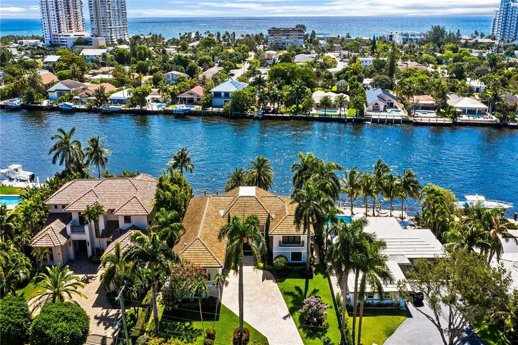 Custom Built Direct Intracoastal Gated Estate Built on RARE ESTATE SIZE LOT 13,821 sq ft. Enter into a wall of windows, soaring ceilings,magnificent view looking at pool deck and the Intracoastal watch the beauty of the aily boat parade. 5bed 4 1/2 bath 3 car garage. 155 ft x 91+ waterfrontage, new dock to keep watercraft. Primary Bedroom boasts 1500 sq ft with SKYBOX lounge/sitting area looking over the Intracoastal waterway.
A glass enclosed, temperature controlled 200 plus bottle wine room, Full house generator, natural gas on property, raised pool deck with geometric shaped pool, multiple outdoor seating and entertaining areas. walking distance to newly renovated Atlantic beach area with new state of the art fishing pier and new Oceanfront restaurants shops and entertainment venues