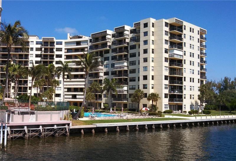Direct unobstructed Intracoastal views from this Northeast Corner 2/2,  1490 sf condo.   Access Open balcony from living room and main bedroom with panoramic water views from every window!  Move in ready, but bring your renovation and decorator ideas with you.  Add your own special touches!  Spacious eat-in kitchen & separate dining room. Guest bedroom with ensuite bath.  Master with large walk-in closet, ensuite bath, full size in unit washer/dryer. Outside unit storage. Building is pet friendly for up to 2 pets, 25 lbs each.  24/7 onsite security, covered garage parking, and a location than can't be beat!  Just a short block over the Intracoastal bridge to the beach - and less than one mile to the new Fisherman's Village beachfront. Buyer to waive appraisal contingency.