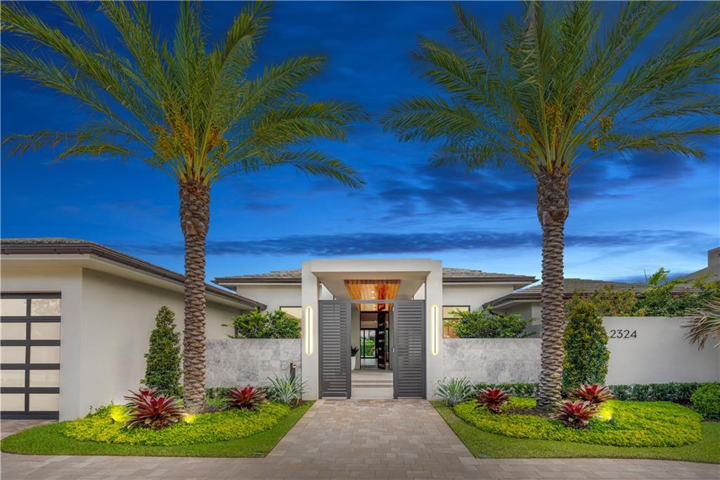 Located in the exclusive Enclave gated community in FTL.  This contemporary 4BR/4BA + 2Half BA home exudes both indoor/outdoor luxury living. Uniquely designed 5535 SF of living space on one level, all BRs are ensuite, Theater Room, Den/Office, Formal Dining Room, and oversized 3 Car A/C garage w/ a 4th bay for golf cart. The stunning kitchen features Thermador appliances and a 12+ft island that opens to the Great Room with 19' Ceilings.  The 1100 SqFt of outdoor space overlooks the resort-style pool, spa & Golf Course.  The primary suite includes 2 walk-in closets and a sitting area. The Spa-like bath is a work of art with a freestanding tub and walk-in shower that opens to a private courtyard. This Breathtaking home sits on a 19,200+ SqFt. Lot w/ views of the Rees Jones Golf Course @CRCC