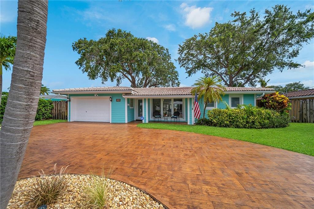 WHAT A VIEW! Located at the end of 110’ wide canal, this beautiful, waterfront pool home has it all – upgrades throughout, impact windows & doors, open & spacious split floor plan, updated kitchen w/ SS appliances granite countertops & tons of storage, 2 master suites w/ renovated baths featuring double shower, jetted soak-in tub &  double vanities, full house generator, tankless hot water heater, saltwater pool w/ waterfall & Tiki hut, new stamped concrete driveway, 55’ of waterfrontage w/ ocean access, dock w/ water & 60 amp hookup & new seawall in 2016. Neighborhood has underground FPL lines & natural gas. Just a quick 10-min boat ride to the Intracoastal & centrally located in Pompano Beach. Easy access to I-95, US1, local restaurants & attractions. 15 mins to FLL & 25 mins to PBI.