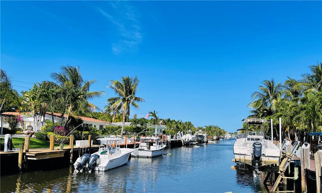 Motivated Seller!! Amazing FULLY REMODELED OCEAN ACCESS home, No Fixed Bridges, located in a MULTI MILLION DOLLAR NEIGHBORHOOD. DOCK YOUR BOAT in your own backyard, PRIVATE DOCK. Large CORNER LOT with Over 1/4 Acrea, great space for a pool. Open Concept floor plan w/a FULLY RENOVATED KITCHEN, Huge Kitchen Island, HURRICANE IMPACT WINDOWS & DOORS, new floors, newer AC, SPLIT FLOOR PLAN, 2 bathrooms have their own EN-SUITE BATHROOMS. Furniture negotiable. Close to awesome restaurants, shopping, just 10 minute drive to Deerfield Beach & Mizner Park(depending on traffic), close to major highways. All measurements and sq.ftg is approximate.  Seller is purchasing another property so they are very MOTIVATED and willing to buy down the buyers interest rate and help with buyers closing costs!