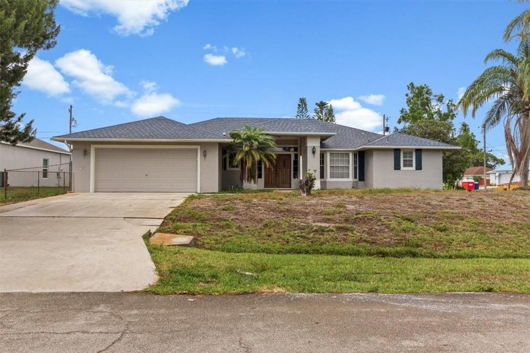 Spacious 3 bed 2 bath home sits on a large corner lot. This property features an attached 2 car garage and a detached 2 car garage on the back side of the property. The backside driveway is located on Ridgecrest Dr.