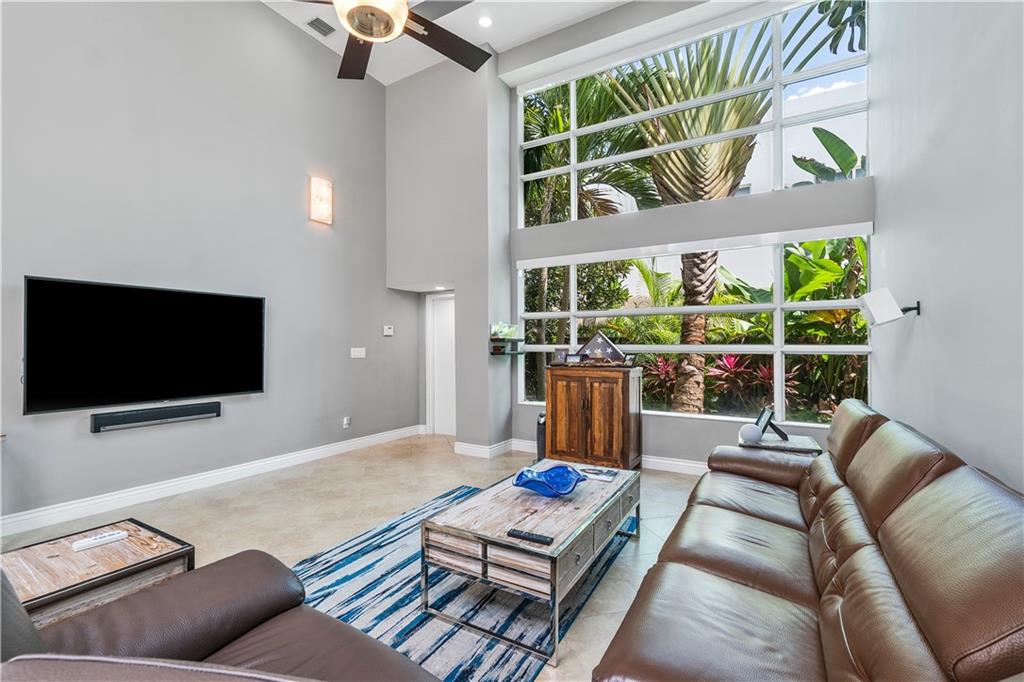 Contemporary Architectural Three Level Townhouse in the Heart of Victoria Park. Property features fabulous roof top terrace with beautiful views of downtown Ft. Lauderdale, three story indoor atrium, 20 foot ceilings in main living space, 2 car garage, impact windows & doors, granite countertops, stainless steel appliances and A/C systems was replaced in 2018.  Walking distance to Holiday Park, Las Olas Blvd restaurants and shopping and Fort Lauderdale Beach. 10 Minutes to Fort Lauderdale International airport.