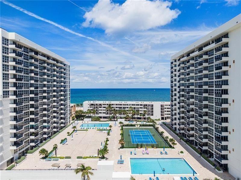 Completely updated two bedroom two bathroom condo across the street from the newly renovated Pompano Beach with amazing ocean views.  This turnkey unit comes fully furnished with floor to ceiling impact windows and doors.  Granite kitchen with stainless steel appliances and new flooring thru out.  Both bathrooms are completely renovated.   Building amenities include 24/7 concierge, gym, 2 heated pools, new outdoor kitchen BBQ area, sauna, library, tennis, bocce, game room and pickle ball, covered parking and climate controlled storage unit. Walking distance to the Pompano Beach Pier.  AC 2017.  Water heater 2001