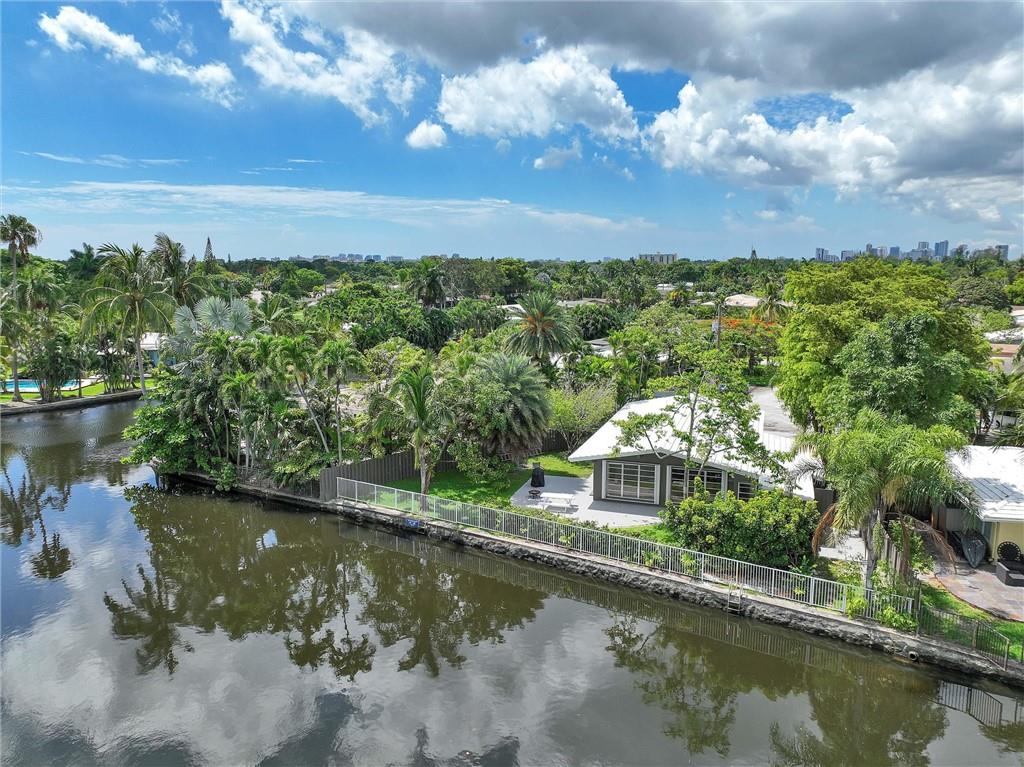 GORGEOUS and amazing opportunity to own an Ocean Access water front home with a genuine Wilton Manors address! This is a gigantic home that can easily be used as a 4/2, or, use one of the fully independent rooms with private entrance for your AirBnB!! Huge home on spectacular water way. Directly across the waterway is the newly approved Mixed Use project called River Manors, a 6 floor spectacular project which will catapult the prices of this and all nearby properties (see attachments). Outstanding kitchen with luscious red granite countertop. Wait til you see the BATHROOMS! Absolutely delightful! Enormous home and property. Rare opportunity to own on ocean access water in this City. Quiet culdesac and near everything you want to be close to - including the "drive." Call for details.