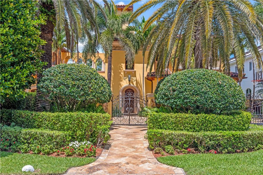 A Gilded-Age Estate built for our time. Offered for the first time, this is a home of exceptional design and superb craftsmanship. 200 feet on WIDE water located in security patrolled Seven Isles neighborhood. Formal and casual living spaces include eight bedroom suites, two family rooms, executive office, den, bar, wine room, estate sized kitchen, butler pantry, two elevators, three laundries, a theater, gym with sauna and steam bath, six powder rooms and multiple fireplaces. The flexible plan allows for an entirely independent four bedroom guest house with its own kitchen, laundry, elevator and garage. Roof top terraces for stargazing and sunsets, a lanai, full outdoor kitchen, meandering saltwater pool, waterfalls and spa, a large lawn and multiple patios. This home has fabulous views.