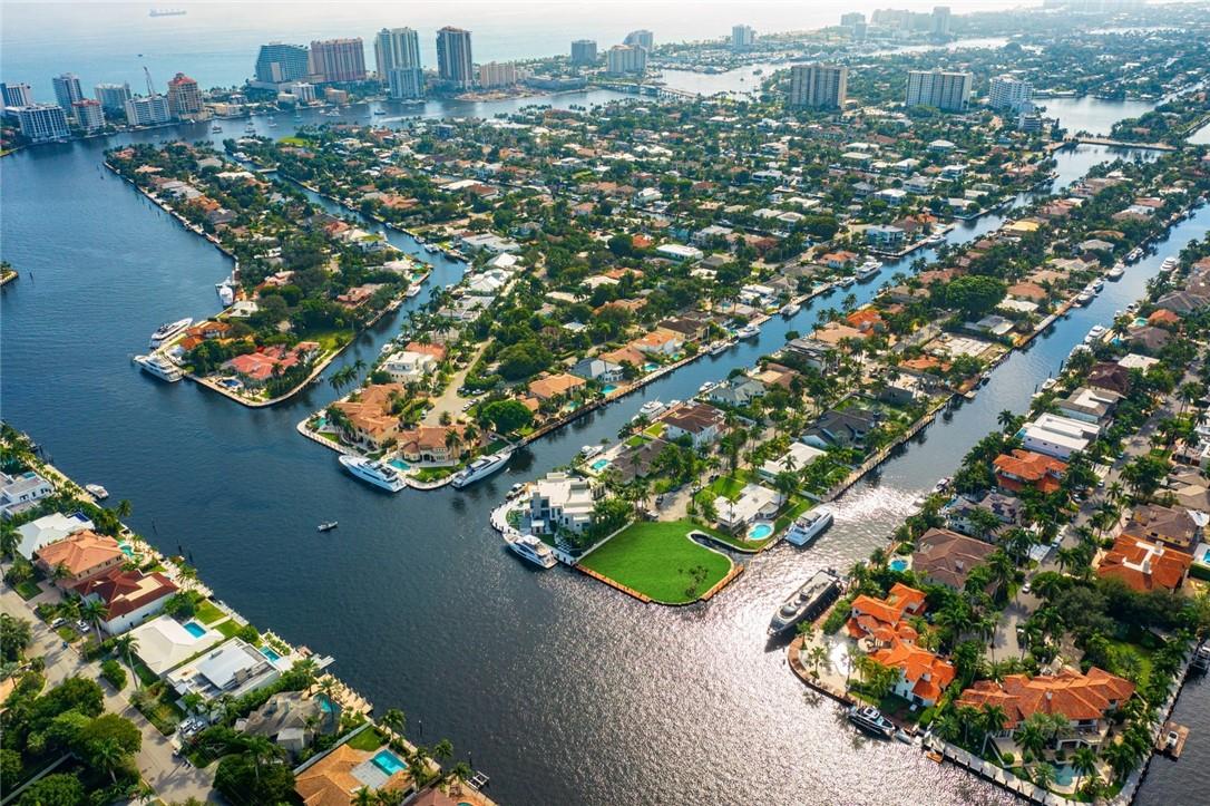 Highly valuable POINT located on one of the finest Las Olas Isles. Points rarely found under $15mm in today's market! Offering a total of 278ft of prime waterfrontage, perfect for a large/multiple yachts.  Note the built in boat slip perfect for tender or water toys.  Property is 19,816sf +/-. Beautiful wide open views across Rio Barcelona. Royal Palm Drive offers underground utilities, natural gas, higher elevations. This is the perfect property to build a trophy point residence that will be increasingly valuable due rarity of point opportunities with deep-water dockage & incredible views! Renderings & site plan by Architect Bruce Celenski/construction consultant Victoria Martoccia Construction - proposed residence air con sf 9,466+/- (total 13,672 sf).