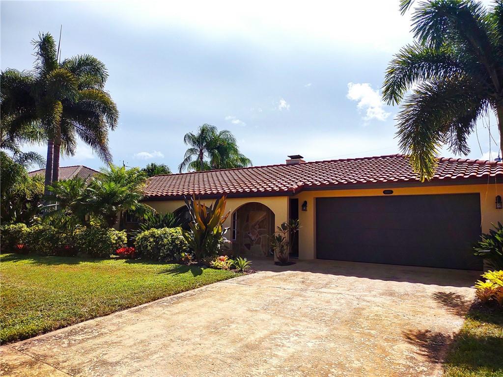 A beautiful home in a highly desirable neighborhood, one mile from the beach and two community parks with Intracoastal boat ramps. This beachy home is a tropical sanctuary w/ mature plantings, secluded backyard, spacious screened outdoor living area w/pool & covered porch. FEATURES: split floor plan, updated custom kitchen w/ Corian countertops & plentiful storage, stone fireplace, ceiling fans in each living area & bedroom, gorgeous Bahamian ceramic tile, spacious master bedroom w/ bath & walk-in closet, new heating & AC (2018), zoned sprinkler system w/ designated well & 2-car garage w/ built-in storage. Juno Isles is a one-of-a-kind community w/ low annual HOA fees, large lots, sidewalks, waterways w/ Intracoastal access plus easy access to shopping, dining, & outdoor activities.