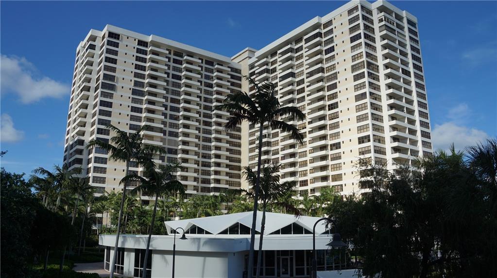 Priced Under Market! Penthouse Condominium with Beautiful Views of the Waterways and Cityscapes both Day & Night from Living Room Balcony & Bedrooms too! 16 Acres Complex has Many Amenities, Recently Renovated World Class Clubhouse, Gym, 2 Pools, Marina, & more! Unit is Ready for Your Personal Touches as Owner Just Installed New Air Conditioning Unit, Working on more!  This 1,580 sq ft home has lots to offer, 14'x31' Tiled Living Room/Dining Room Combo with Built-In Wet Bar & Wine Cooler; 10'x16' Tiled Eat-In Kitchen with Walk-In Pantry & Broom Closet; 14'x16' Carpeted Primary Bedroom with XL Walk-In Closet, 2nd Closet, & Dressing Area, Tiled Primary Bathroom Comes with Spa Tub/Shower Combo & Bidet, Tiled 2nd Bedroom with Dual Closets too! To Be SOLD AS-IS. This Spacious Luxury Condominium Is Priced For A Quick Sale That You Can Renovate to Your Own Taste!!  See It Today For It Will Go Fast At This Price!!!  Unbelievable Views From Every Window That You Will Love Both During the Day and Evening!!  Perfect For Entertaining Too!!  Assessment Has Been Fully PAID Off!!  Furniture May Be Included In Sale Too!  Available AS-IS.