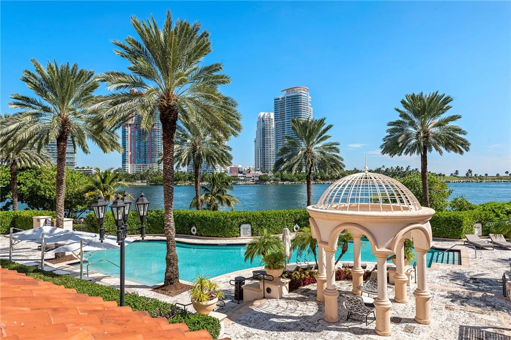 ABSOLUTELY UNIQUE! +/-5,500SF COMPOUND of a principal residence(4bd/4,5b), guest house(1bd/1b) & separate apartment(1bd/1,5b) connected by a private +/-7000SF terrace overlooking pool & Miami's ocean Inlet. The expansive private terrace provides versatile space for relaxing sun decks & gardens, dining & entertaining, areas for children & pets to play & roam. Inside, no expense was spared on elegant Italian custom finishes, furniture, exquisite limestone floors, exotic Macassar Ebony wood, stainless steel, onyx walls & vanities in the bathrooms, Lalique glass, Baccarat chandeliers & light fixtures, & more! Property features 2 fireplaces, 3 kitchens, 3 living rooms,, 2 laundry rooms, 2 storage rooms on the ground floor. 24hr concierge, valet parking, movie theatre & gym. Verify all info.