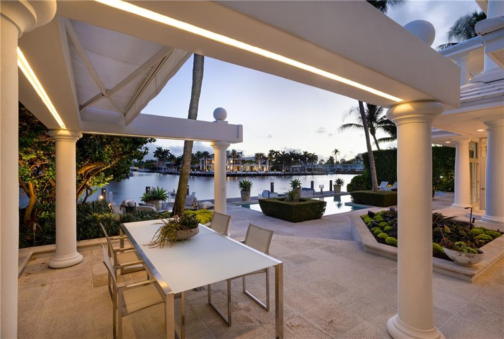 Outdoor entertaining areas off the kitchen overlooking waterway and sunsets.