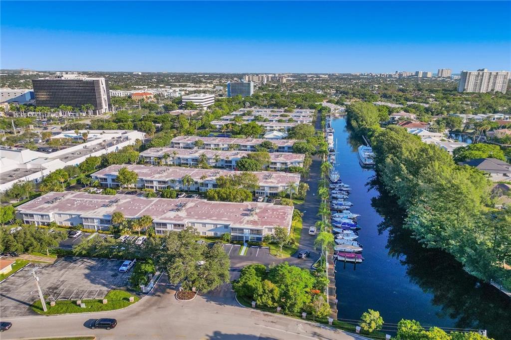 Welcome to the Highly Desirable Bay Colony Club. This spacious 1st floor 2/2 features W/D in unit, tankless water heater, enclosed porch, lots of storage, large closets and more. This community is a hidden gem in Fort Lauderdale, Lush 30 Acre complex with amenities for every age and Boat Dockage available for boats up to 50ft $1.50/foot. Amenities include: 4 heated Pools, 6 tennis courts, 3 clubhouses, 2 exercise rooms, pickle ball courts & a pool along the Intercoastal w/ bar. 24/7 Security with gate & patrol private guards. Incredible location minutes from the beach, restaurants, shopping, and more! Bay Colony Club is the only gated deepwater Intracoastal community east of US1 just 2 miles from LBTS.