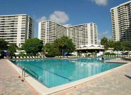 Highly DESIREABLE/Sought AFTER 14-LINE CORNER Apt in Luxurious FULL AMENITY Olympus Condo situated in the Exclusive 3 Island area in Hallandale located right on the  Intracoastal. The Unit requires updating but with your personal touch and incredible views ..... Full 2 Bed 2 Bath CORNER UNIT providing 1580 sq ft of Liv Area (largest in the Bldg) with COMPLETE Amenity package incl- 24 Hr Manned Security, Valet, Olympic Size pools, Marina Boat Docks, State of the art Fitness/Gym, Yoga Studio, Sauna, Tennis (5 Courts,) Courtesy Shuttle Bus, Billiards, Business Center, Veh Car Wash, BBQ, Self service Cafe, Extra Storage, Clubhouse, Assigned COVERED Parking ..walking distance to Beach/Ocean, Yes to Pets (Emotional Support w/Letter) and can be leased immediately after closing. HOA is $1027/month This Unit requires TLC and may be a Handy Man's special. The unit has been Leased for the last several years and the tenant is winding down their lease scheduled to end of January. For this size Apt, on this exposure line, it is priced to sell below current market for same size unit and can be updated by future owners with their tastes/and personal preferences in mind. Customize this unit to what can be your future home.