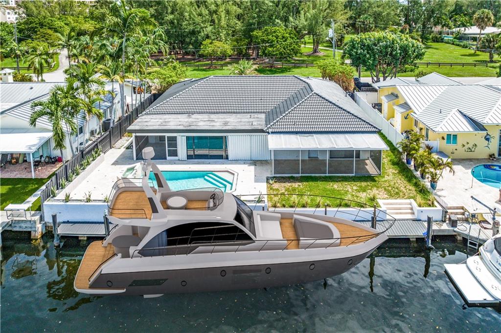 Stunning Boaters Paradise with 80 FT Dock on Deepwater, with No Fixed Bridges to Access Ocean! Start living in your dream home 4 BED/3 BATH with POOL & Newly renovated in the coveted Country Club Isles neighborhood, quite and beautiful area with view of Harbor Park with children's playground, tennis and basketball courts, and walking trail! Stunning timeless bright and modern style remodel includes large porcelain tile, and recessed lighting through the home, bathrooms featuring rain showers and new vanities, 2 NEW A/C units, and primary room has built in closet space for additional storage. Sit and enjoy your morning coffee with in the enclosed patio space from your primary room over looking the pool and canal.