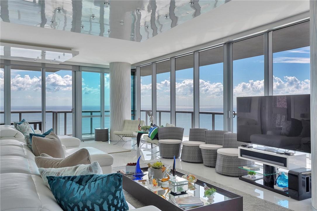 Majestic panoramic views from ocean and city views. This unit has been furnished and designed impeccably with modern finishes and furnishings. It is a corner unit on the 42nd floor encompassing 4 bedrooms / 4.5 bathrooms. Featuring white marble throughout the unit, reflective ceilings with mood lighting, custom walk-in closet and an upgraded Jade Ocean kitchen. The wrap-around balcony accents the unit's ocean and city views.