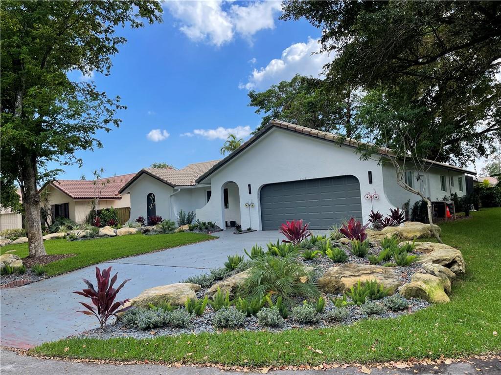 Nestled in a quiet Coral Springs neighborhood, this stunning home has been completely remodeled to perfection. No detail overlooked. Incredible open floor plan blends modern luxury, elegance & state-of-the-art details. The neutral, yet inviting porcelain wood-look floors, quartz countertops, complete w/hihats throughout are features that make this home truly exquisite. Kitchen comes complete w brand new, never used stainless steel appliances and custom cabinetry.  The spacious bedrooms and beautifully appointed bathrooms offer a peaceful retreat. The outdoor living area is perfect for relaxing or entertaining while enjoying the beautiful fully screened pool and all new lush landscaping. All new windows/doors.  Every corner of this home has been thoughtfully updated. Complete w Tesla SOLAR! o INTERIOR
? Entry  
• You will be met by a stunning combination of subtle colors and light that will make you feel like you have just entered a modern home ready for your furniture and family
• The modern open foyer sets the tone for this home's grandeur and sophistication, welcoming you with its light and open feel.  
? Living Room
• The living room is seamlessly integrated into the floor plan and is not only visually stunning with its clean lines but also perfectly functional for today's family with space for ample seating, integrated technology, and a view of the landscaping and welcoming pool.
? Kitchen
• The magnificent brand new eat-in kitchen is the epitome of style and functionality, featuring upscale stainless steel appliances, Quartz countertops, custom cabinetry and a spacious dining area that's perfect for today's family to gather and enjoy meals together.
? Family Room
• The family room, opens to the eat-in kitchen and has direct access to the pool area, provides the perfect space for today's family to relax, entertain and enjoy quality time together in a stylish, comfortable setting.
? Bedroom 1
• The comfortable bedroom offers ample space and versatile room that can easily adapt to a family’s growing and changing needs.
? Bedroom 2
• The bedroom features a generous walk-in closet and is perfectly sized to provide ample and functional space to relax and recharge in style.

? Bath 1
• The beautiful all new secondary bathroom is complete with double sinks, Quartz countertops, large drawers for storage, and a shower/bath combo, with rain shower head and hand-held on an adjustable arm creates a calming oasis where one can get ready in the morning or wind down at night in comfort and style.
? Primary Bedroom and Closet
• The perfect primary bedroom boasts breathtaking views of the beautiful pool just outside its French doors, creating a serene and tranquil retreat where you can unwind and enjoy the ultimate in relaxation. The space also features a large walk-in closet with custom built-ins that provides ample storage while enhancing the room's overall design and functionality.
? Primary Bath
• The luxurious primary bathroom is complete with new custom his and her separate vanities, a relaxing walk-in shower with rain head and hand-held that creates a spa-like experience and can melt away the stresses of the day, providing the ultimate in comfort and luxury.

o EXTERIOR
? Pool
• Never want to leave your home with its’ beautiful large screened-in area.  This is the perfect place to entertain and relax, featuring a fire pit for cool evenings and a crystal-clear pool for refreshing fun, all surrounded by new LED lighting and state-of-the-art new equipment that will ensure enjoyable and hassle-free leisure time.
? Landscaping
• The all-new corner-to-corner landscaping beautifully blends the stately trees that define the neighborhood with new, fun, and visually pleasing plants and flowers, and features all new sod that creates a lush and inviting outdoor space. The oversized corner lot offers plenty of room for a front privacy coffee space, playing catch on the side yard, and more, making this visually stunning outside area the perfect place for everyone to enjoy.
? Security
• The home is equipped with the latest security and functional features, including a Ring doorbell and three cameras that allow for remote phone viewing and 24/7 monitoring through a convenient app, giving homeowners peace of mind.
? Solar
• The home comes with brand new Tesla solar panels, fully warrantied for 25 years!  You can have electric bills as low as $20-$40 per month. If your FPL bill averages $200+/month before solar, that will amount to a huge savings AND further FPL increases won’t affect you, your monthly savings will just keep growing!

o MISCELLANEOUS
•  Upgraded Electrical Service and Panel
•  All New Pool equipment
•  All New Hurricane rated windows and French doors
•  All New Sprinklers, Sprinkler pump and manifold
•  Designer Porcelean tile throughout
•  Quartz Designer countertops and backsplash 
•  LED hihats everywhere!
•  Designer Light fixtures (interior and exterior) and above and undercabinet lighting
•  Brand new never used, fully warranteed appliances
•  A/C Unit and ducts and Dryer Vent, cleaned and sanitized
•  Custom Kitchen & bath cabinets with sought after upgrades: soft close, pull outs, trash rollouts, spice pullouts
•  Primary Bedroom Closet features floor to ceiling custom built-ins
•  Upgraded bathroom fans are virtually silent
•  Custom base moulding and door casing that is vacuum dent resistant, super smooth, maintenance free!
•  Sherwin Williams Paint inside and out!
•  New quiet Garage door opener with outside keypad
•  10 year, NO - battery - Change smoke detectors throughout
•  LED / No fog, Super Bright Lighted mirrors over all Bath Vanities
•  Each Bath is equipped with luxurious rain head, hand held on slide bars and waterfall spouts and faucets