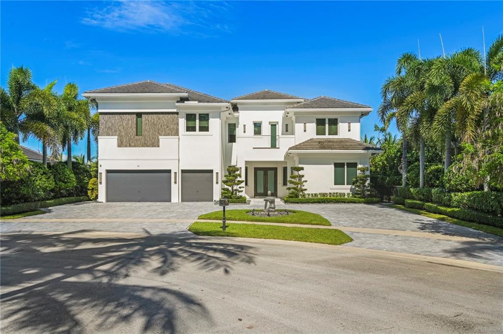 Welcome to Hawks Landing, a neighborhood secured by a 24/7 manned gate. Unparalleled, beautifully sited private lakefront home on a cul de sac. Upon entrance, enjoy the open floor plan, grand ceilings, and beautiful porcelain tiles. This home exudes luxury, including a gourmet kitchen with Thermador appliances, marble countertops, and custom cabinetry. The primary bedroom suite leaves nothing to be desired with beautiful outdoor views, a romantic spa bathroom with an acrylic freestanding soaking tub, separate shower, and three oversized walk-in closets. This home is complete with 5 more spacious ensuite bedrooms. Outdoors, a decadent infinity pool/spa with fiber optic lighting, a warm welcoming alfresco kitchen, lake views, and more. Also, equipped with hurricane impact doors and windows.