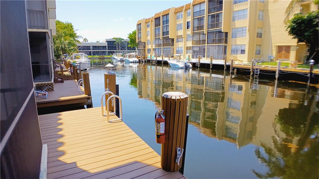 DEEDED DOCK!!! This 2 bedroom 2 bathroom 1st floor condo is located in the desirable community of the Island Club. Condo features 2 tastefully remodeled bathrooms, new laminate flooring, parking directly out front, and a DEEDED DOCK for up to a 27' boat directly out back. Community offers over 5 acres of lush tropical landscaping, 24 hour manned security, courtesy bus, heated pool, hot tub, sauna, billiard room, function hall, etc. Close to shopping, dining, beaches, golfing, and newly rejuvenated Pompano Beach Pier!!! Association charges a $300 refundable move in/move out deposit. Tenants must provide Renters Insurance.